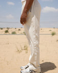 Cream linen slub trousers showing single pleat detailing