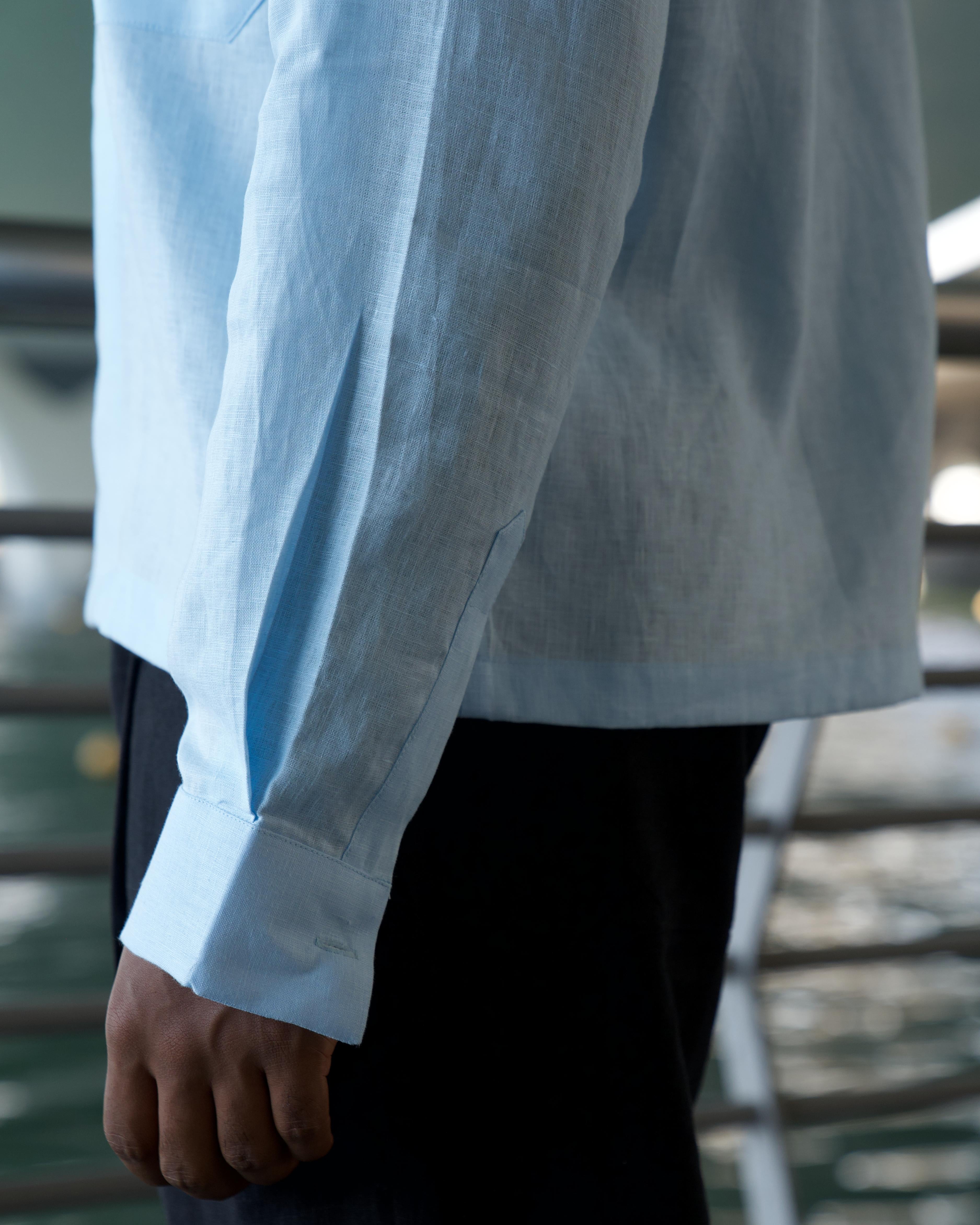 Pale blue linen shirt with cuban collar and double breast pockets