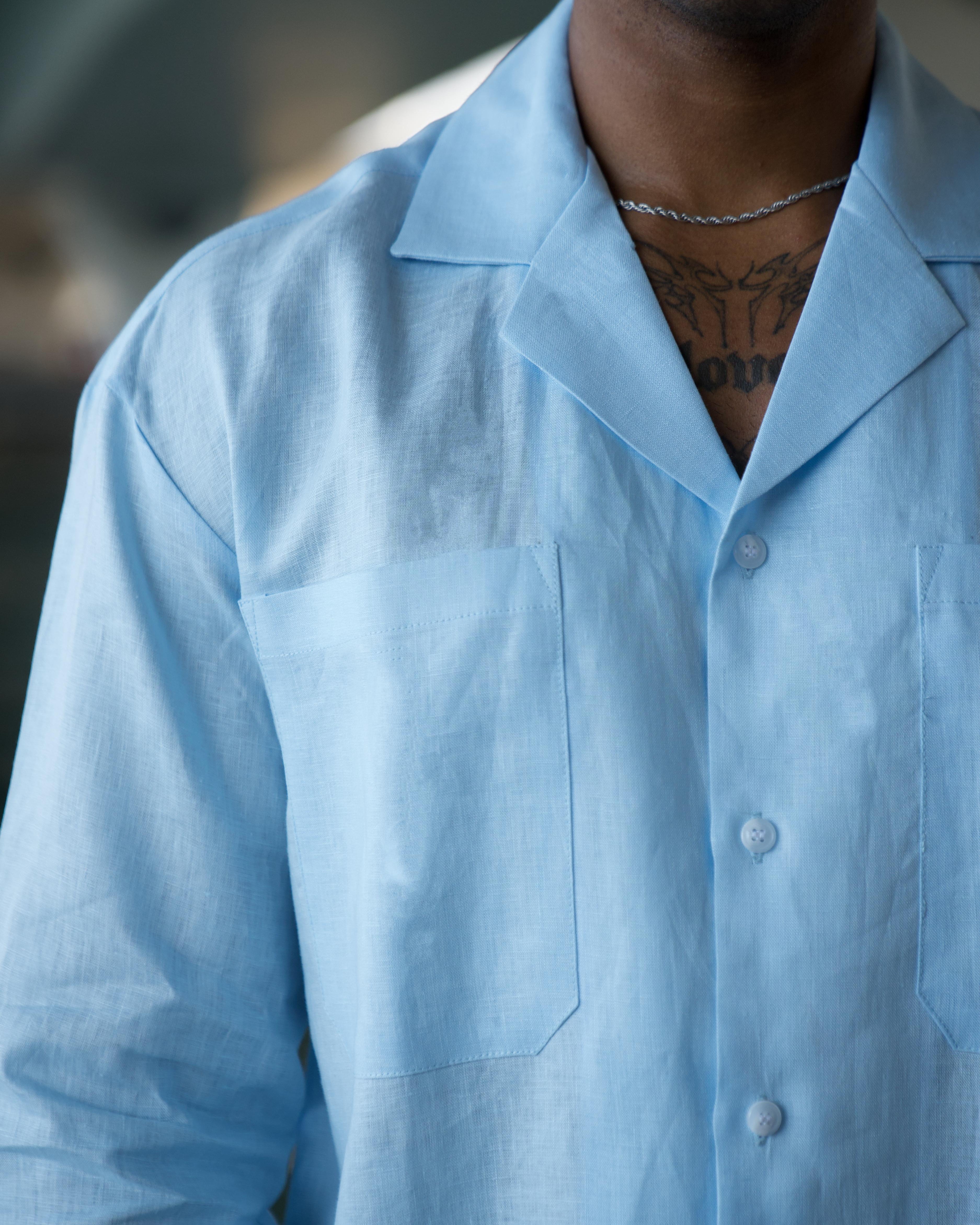 Linen fabric and white resin button detail in pale blue