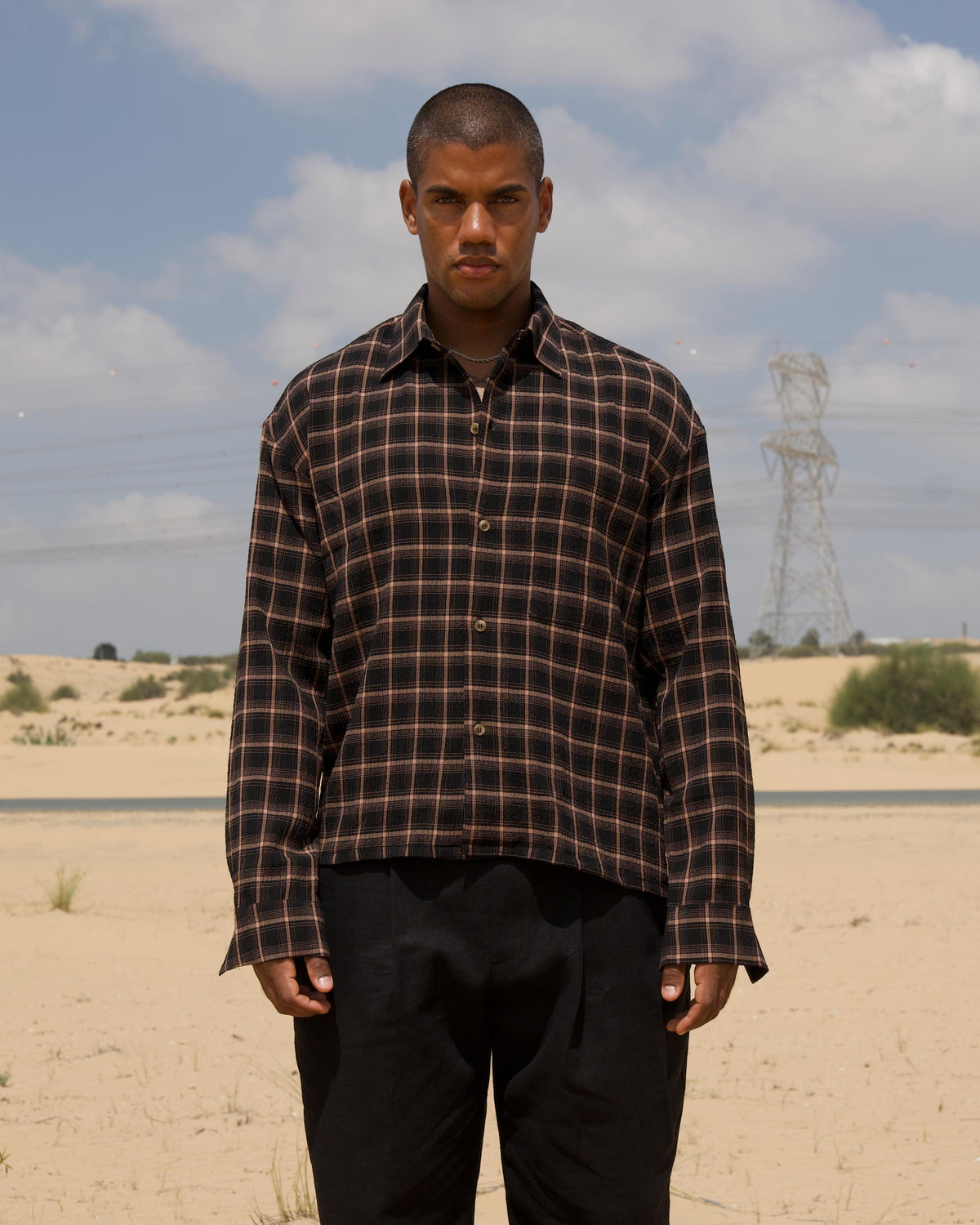 Model wearing the brown Check Shirt, cropped boxy fit