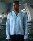 Model wearing the pale blue Laidback Shirt, cropped boxy fit
