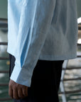 Pale blue linen shirt with cuban collar and double breast pockets