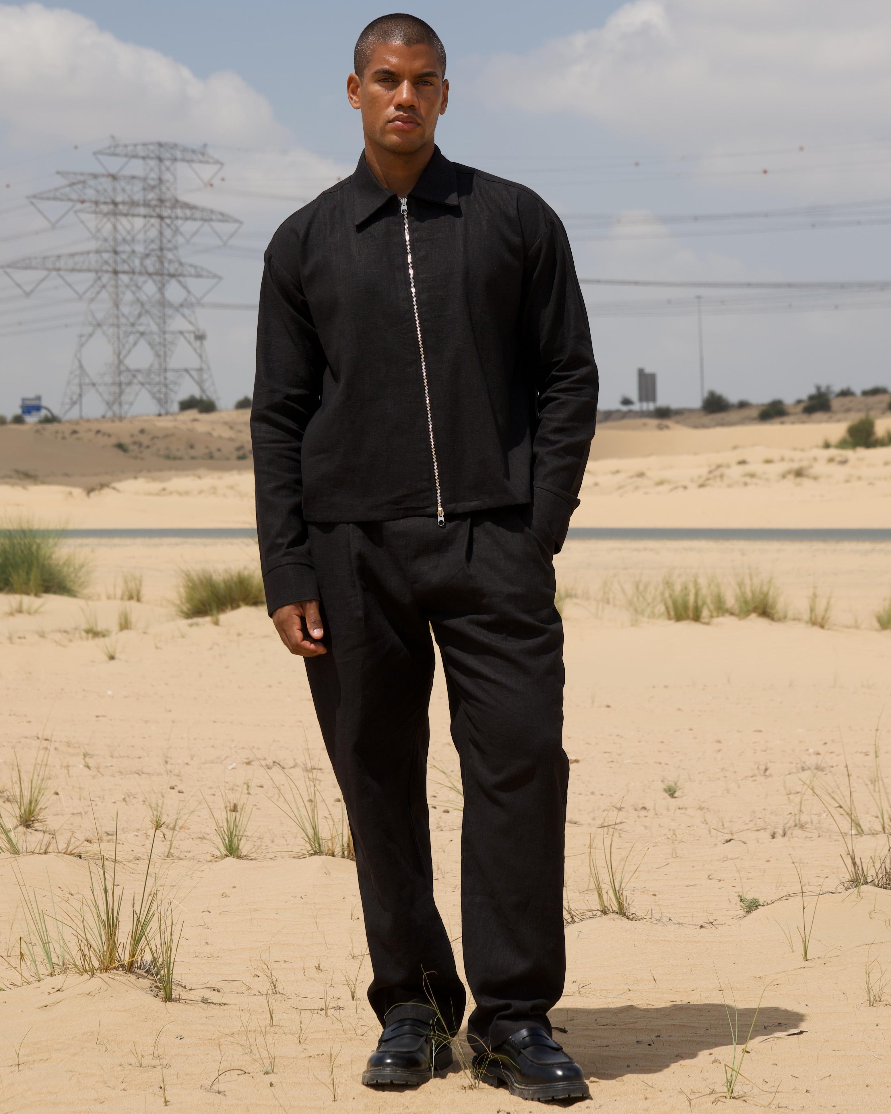 Black linen slub trousers showing single pleat and slash pockets