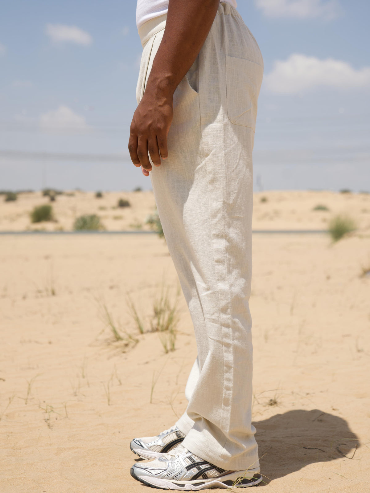 Cream linen slub trousers showing single pleat detailing