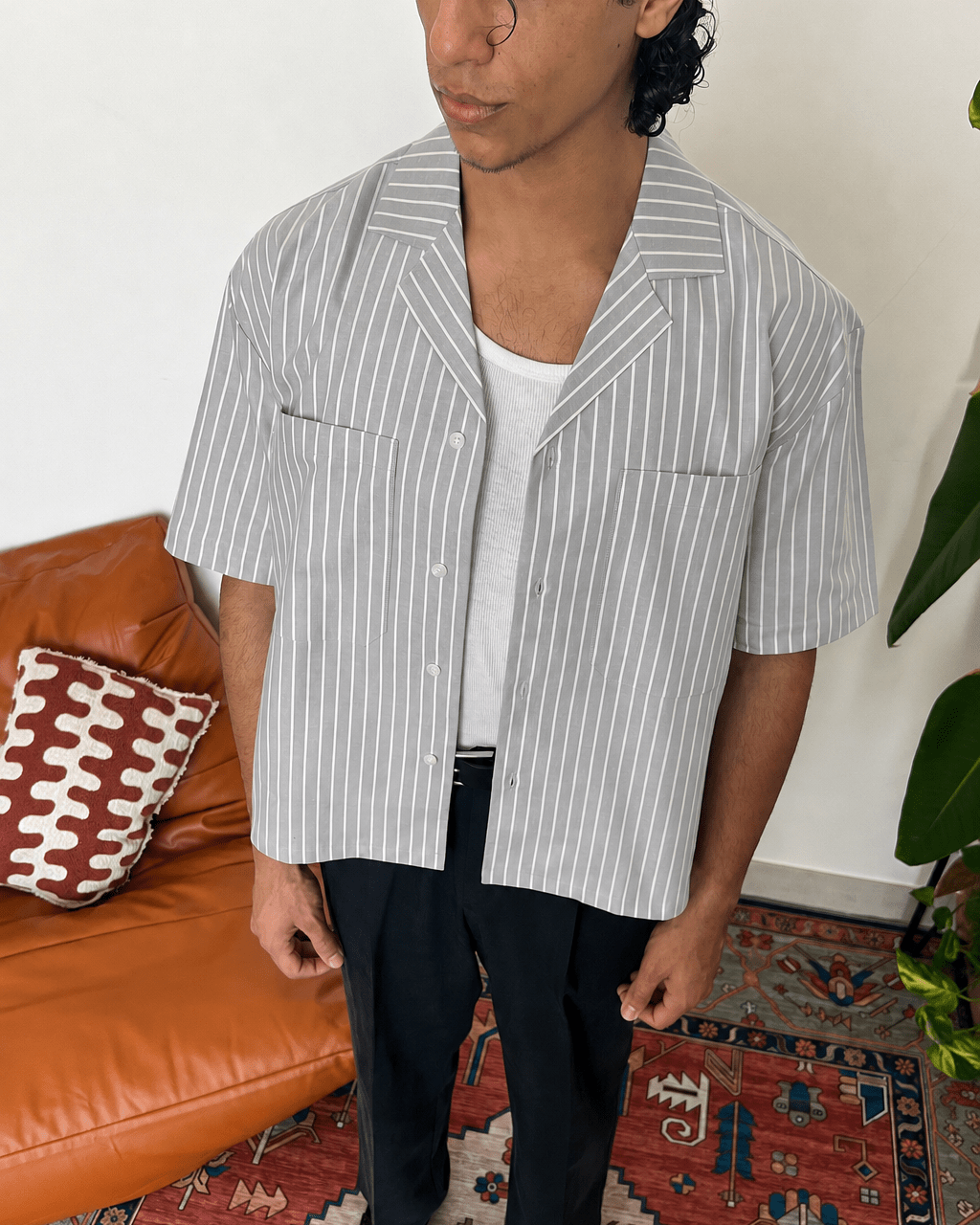 Model wearing the grey Smoke Pinstripe Shirt, boxy fit with cuban collar